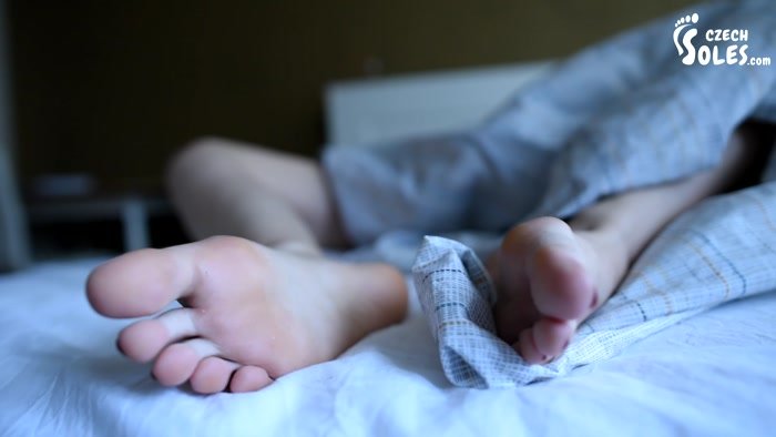 Czech Soles  Hard sleeping girl's bare feet in bed